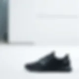 Stylish black athletic shoes on a clean background