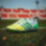 Stylish Adidas green and white cleats displayed on a football field