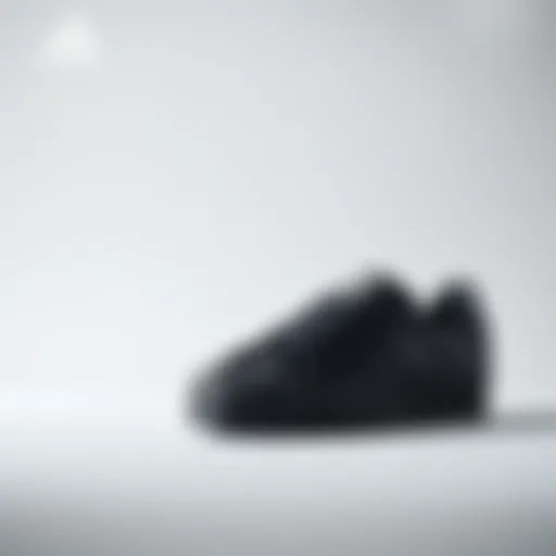 Stylish black Adidas Superstar shoes on a minimalist background